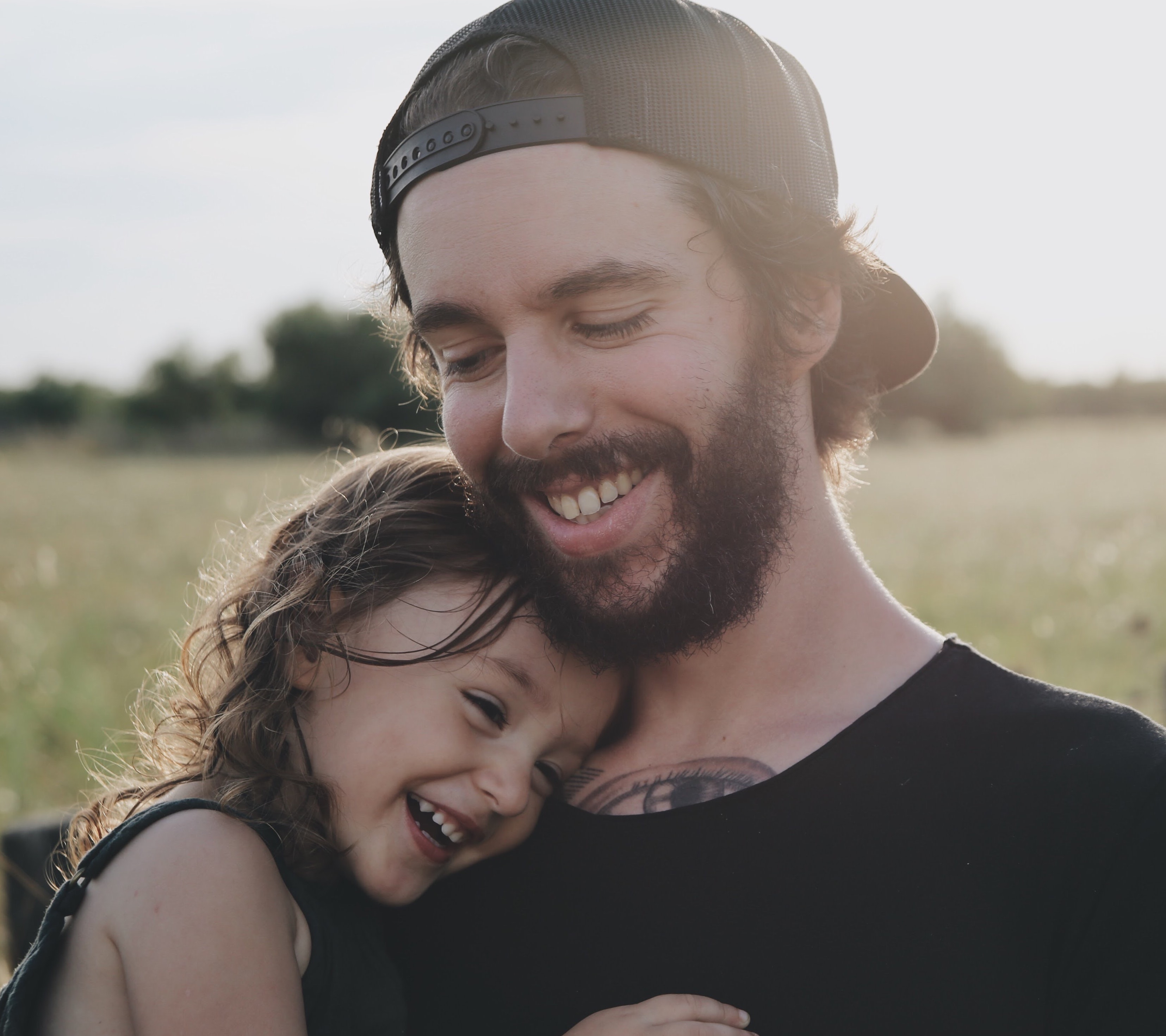 Man smiling with his daughter